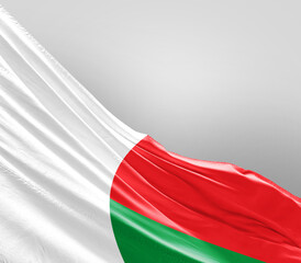 Madagascar  flag waving on grey background. Madagascar nationalflag for independence day.