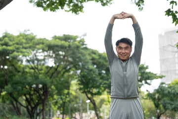 Asia elderly man stretching exercise outdoor park
