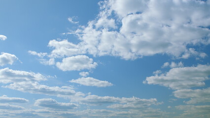 A Beautiful Serene Blue Sky with Fluffy White Clouds A Tranquil Atmospheric View