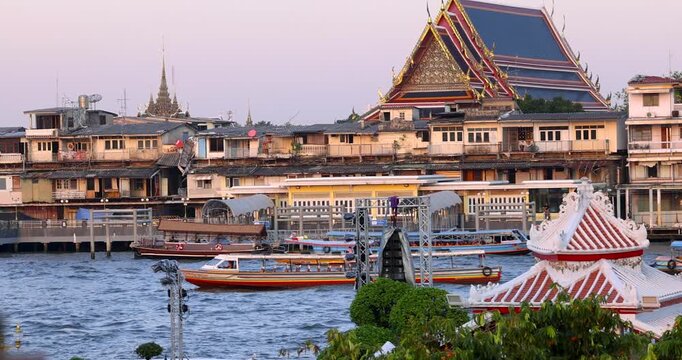 View of boats and historic monuments Wat Phra Kaew, Temple of the Emerald Buddha. The Grand Palace Bangkok, Thailand