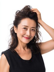 Obraz premium portrait of gorgeous happy middle aged mature asian woman senior older 50s lady pampering her hair looking at camera isolated on white ads of anti age skin and hair care spa copy space no logos no br