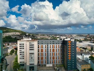High Angle Drone Camera Footage of Swansea City Centre Near Coastal Beach During Sunny Day of July 14th, 2025. Swansea is Most Beautiful, Modern City and county on the south coast of Wales, UK