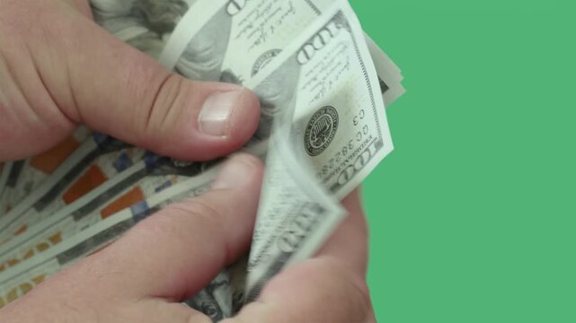 Counting hundred dollar bills in hands showcases cash handling techniques and money management skills