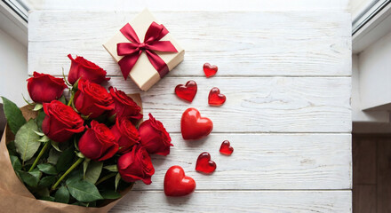 A beautiful bouquet of red roses with a gift box on a rustic white wooden table.romantic bakc backgroun , 