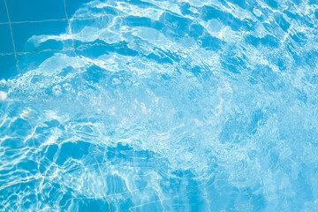 Air bubbles in clear blue water.