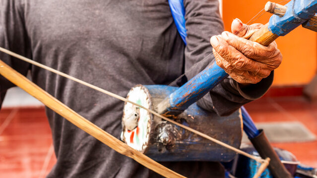 Oldman playing rebab music instrumental