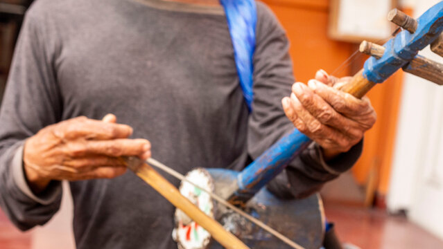 Oldman playing rebab music instrumental