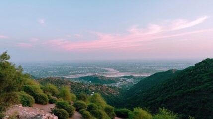 Naklejka premium Breathtaking Sunset View Over Serene Valley with Lush Green Hills and Majestic River Flowing Through Landscape