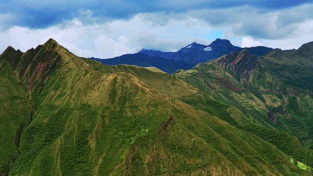 Peruvian Andes mountain range Limatambo Heertahuayco mount Humantay Salkantay Peru aerial drone highlands avocado farm crops Cusco region warm climate Soray rainy season clouds pan left motion