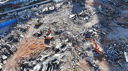 Industrial Demolition Site with Mechanical Excavators at Recycling Terminal