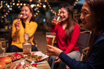 young couple celebrating with champagne at night