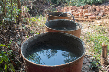 Obraz premium Water Filled Drums in Outdoor Area