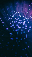 Vertical abstract background featuring deep blue and purple glowing bokeh lights with floating particles in a dark space.