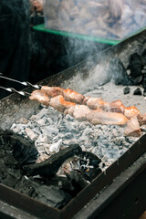 Meat Skewers Grilling on Charcoal Mangal with Smoke