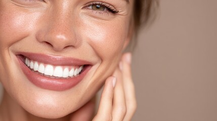 Fototapeta premium young woman smiles showing perfect white teeth healthy smile clean mouth and radiant skin she touches her face gently exuding happiness and well being