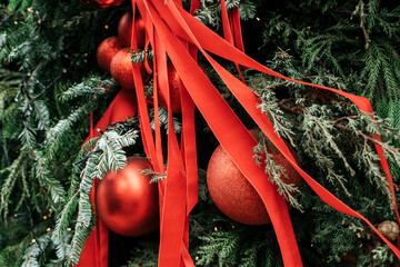 Festive Christmas Tree Decorated with Red Baubles and Ribbons