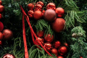 Festive Christmas Tree Decorated with Red Baubles and Ribbons