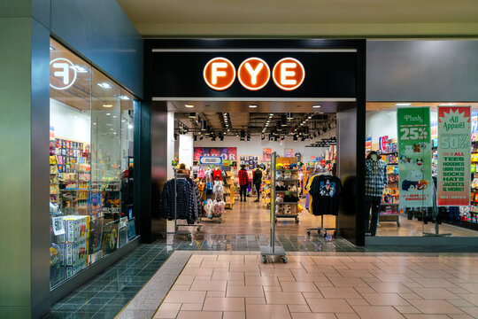 Syracuse, NY - Dec 18, 2025: Selective focus of FYE (For Your Entertainment) store at Destiny USA mall with illuminated signage, apparel racks, and pop culture merchandise with 200+ stores nationwide