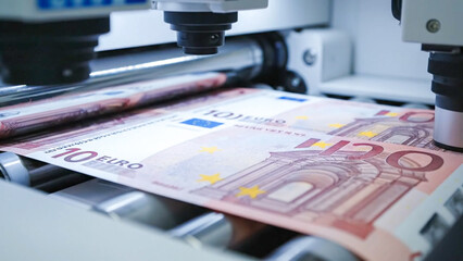 Industrial machine using laser sensors to scan and verify Euro banknotes