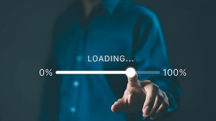 Hand touching a glowing loading progress bar overlay in blue-toned tech concept