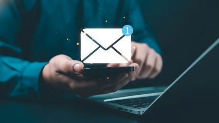 Hands holding a smartphone with a glowing white email envelope icon and blue notification badge
