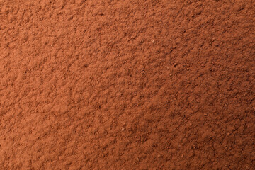Pile of cocoa powder as background, top view