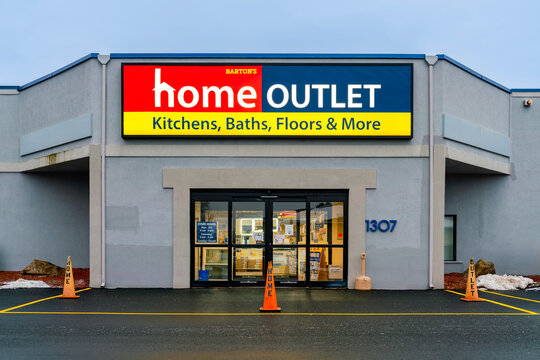 Utica, NY - Aug 5, 2025: Night view of Home Outlet, a discount home improvement retail chain founded in 1885 as part of E.C. Barton & Company. It operates over 106 locations across 20 U.S. states