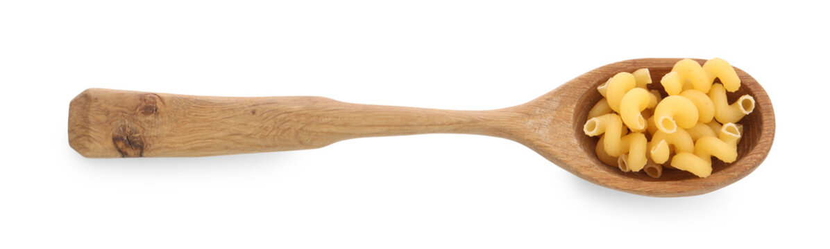 Raw cavatappi pasta in wooden spoon isolated on white, top view