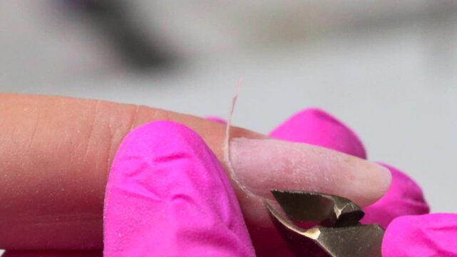 Careful Removal Of Hangnails By Professional, Salon Technician Expertly Cleaning And Smoothing Fingernails. Media