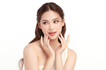 A beautiful young Asian woman with clean, fresh skin against a white background. Skincare, facial treatment, cosmetology, beauty, and spa. An elegant portrait of an Asian woman.
