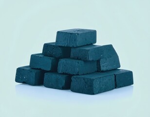 Stacked dark blue rectangular blocks forming a pyramid shape