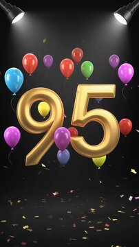 Number 95 in the spotlights with balloons in the background. Festive scene for birthday or anniversary party