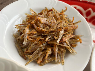 fried fish with sauce and vegetables