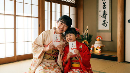 お正月にお年玉をもらい喜ぶ晴着を着た子どもたち