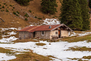 A hike along the Bavarian Chiemgau on the way to the Hochfelln peak and stop by beautiful farmers sheds