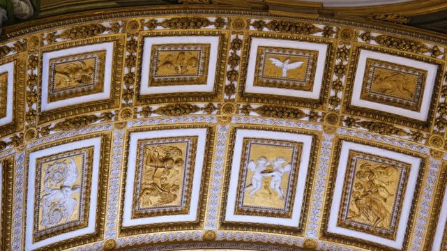 gilded ceiling inside saint peter's basilica ornate richly decorated reflecting baroque artistic grandeur decoration detail vatican city sacred space 