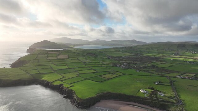 Epic Ireland drone rising to reveal entrance to Dingle Harbour beautiful rural landscapes in Kerry