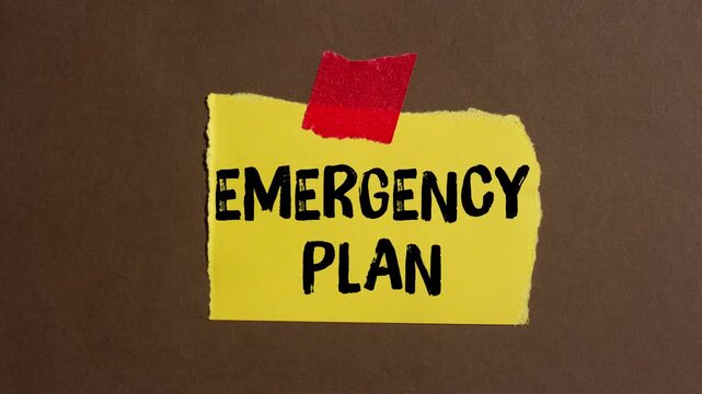 Emergency plan message written on ripped torn paper background. Conceptual Emergency plan symbol.