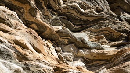 Close-up of rocky mountain cliff face, detailed stone textures, geological formations, natural patterns, professional nature photography, sharp focus, commercial stock image, rugged terrain