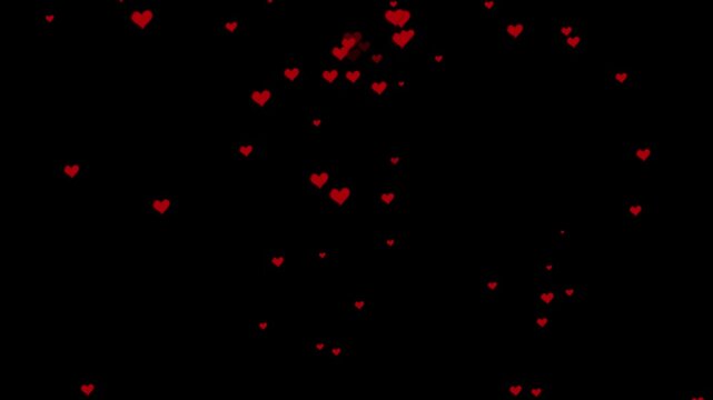 Soft scattered cloud of red hearts floating on a black background for romantic video overlays