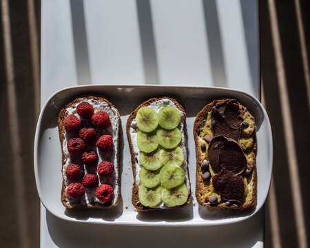 Fresh fruit snack box with berries, kiwi and banana slices
