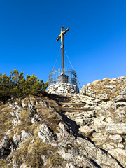 Chiemgau as a Bavarian Region with a beautiful summit cross peak view and a true hike destination 