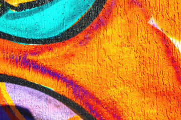 Abstract graffiti wall with bright orange, purple, turquoise colors. Urban street art style, vibrant contrast, bold shapes. Posters, flyers, backgrounds, creative banner, digital art.