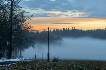Winter sunset with inversion fog from valleys in Nemci village