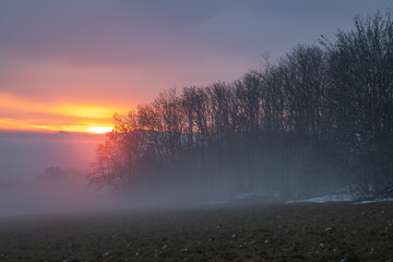 Winter sunset with inversion fog from valleys in Nemci village