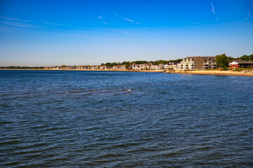 Coastal view of residential homes and beachfront buildings along Walnut Beach in Milford, Connecticut, USA