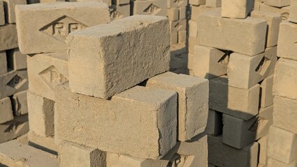 Red bricks Solid clay bricks used for construction, solid fireproof clay brick used for the construction of fireplaces and stoves, on an isolated white background