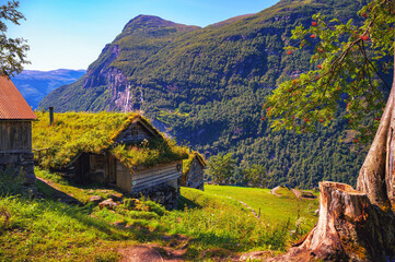 Historic Skagefla farm on a steep mountainside above Geirangerfjord in Norway.