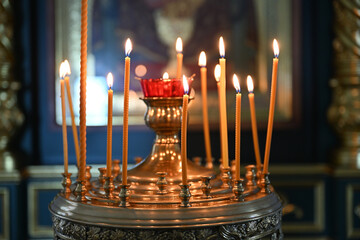 Close-up burning candles in the Orthodox church
