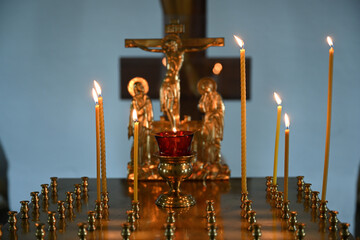Candles burning in the church for the memory of the dead.